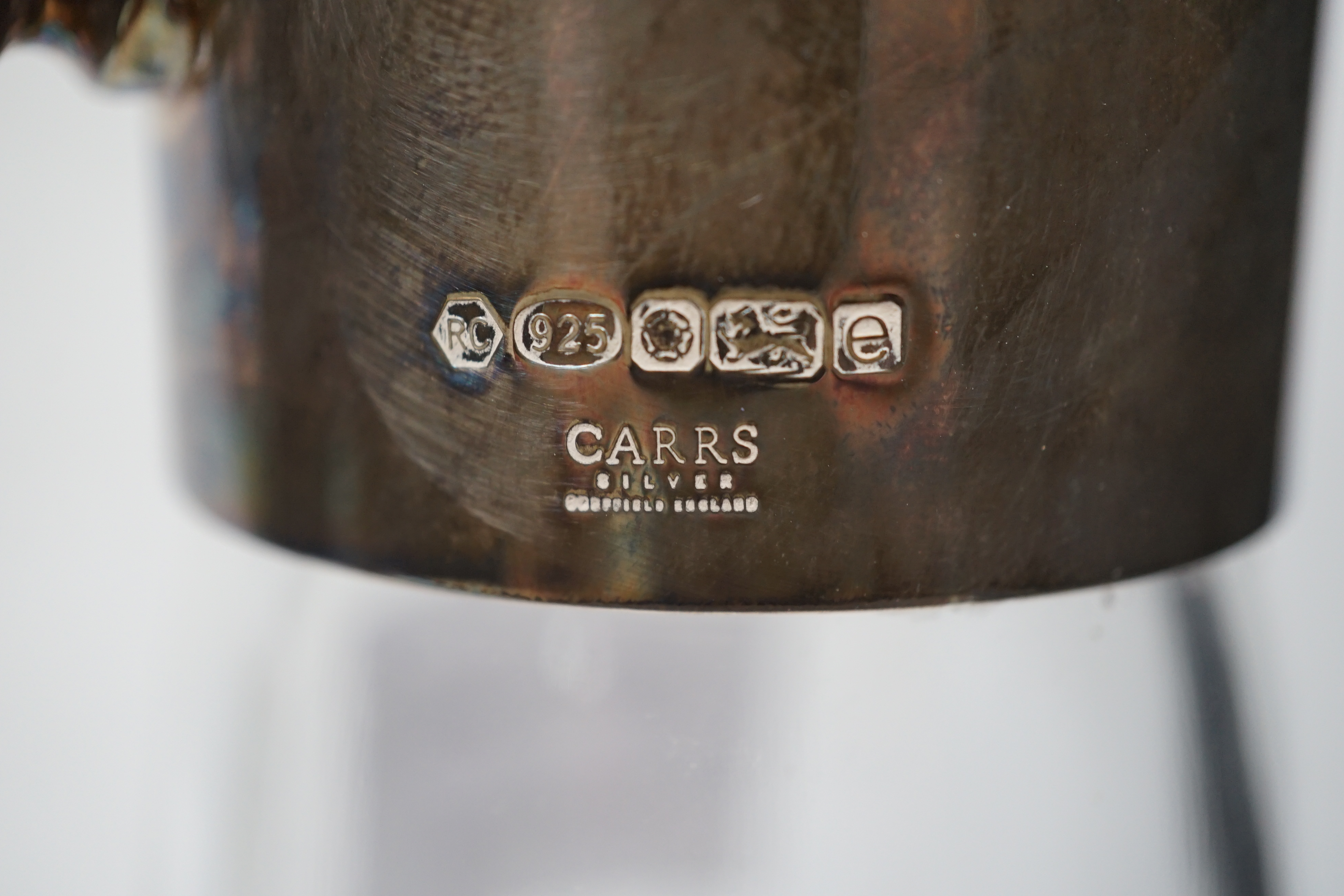A Carr's of Sheffield modern silver mounted cut glass ship's decanter and stopper with matching silver mounted decanter coaster, Sheffield, 2007/8, one other similar decanter coaster and a silver mounted glass claret jug